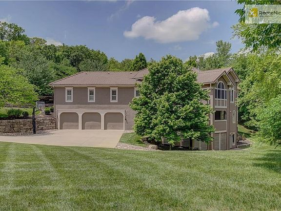 6600 sq ft of finished living, 6 car garage, 2 covered decks, 1 uncovered deck, patio and private wooded lot...