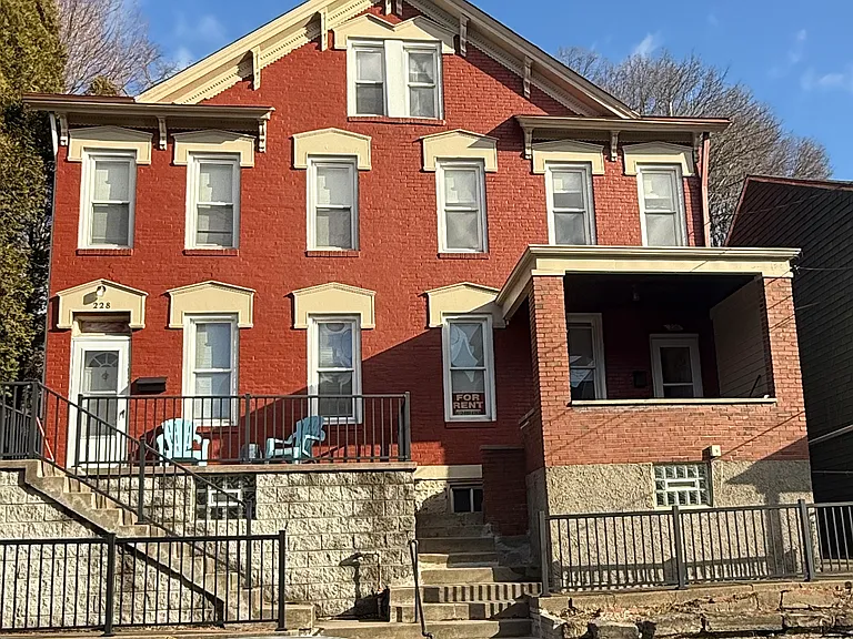 Left side of this duplex is available_with covered front porch and permit parking.