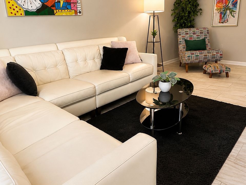 Modern Living Area with large sectional and reading nook