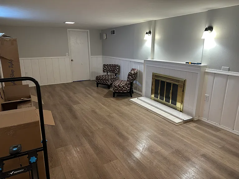 basement rec room. There is a large room behind the fireplace that houses the furnace and washer/dryer, plus a large amount of storage