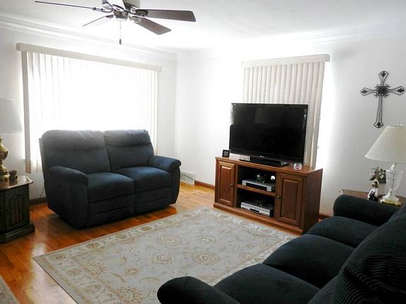 Charming living room consists of gorgeous hardwood floor