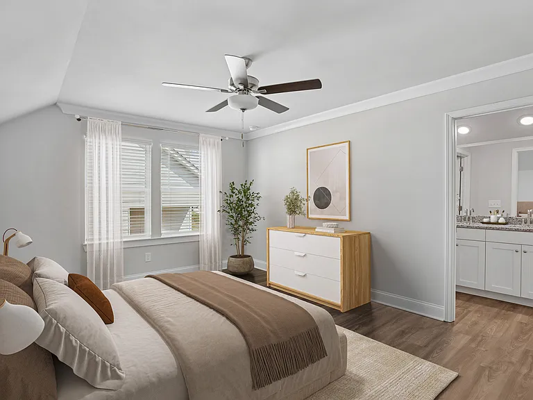 Secondary view of the bedroom with entry to the primary bathroom
