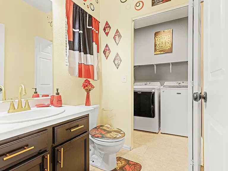Bright and airy bathroom with a convenient in-unit washer and dryer. Perfect for freshening up after a day of exploring.