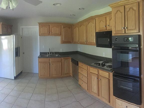 Eat in Kitchen, 4 season to left, laundry & half bath through door near sink