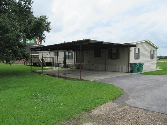 Double Carport (enters into den/dining area)