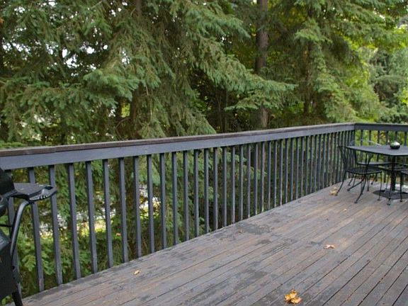 Formal dining area has sliding door to back deck for summer barbecues.