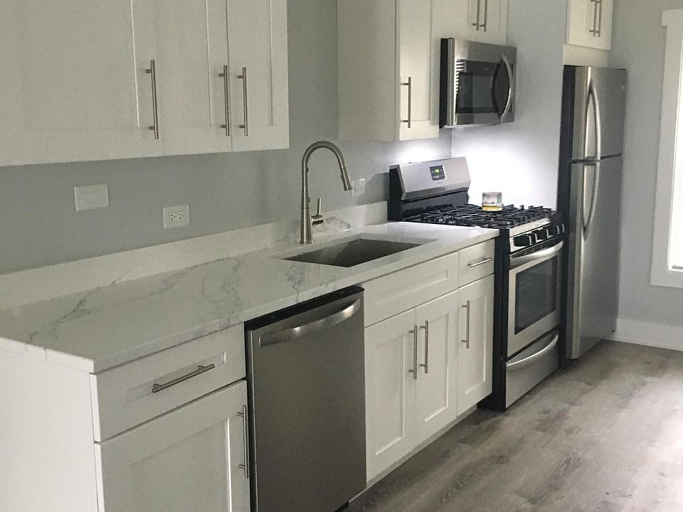 Quartz counters, soft close white shaker cabinets, brand new