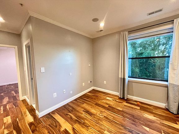 View of living area and hall from the kitchen.