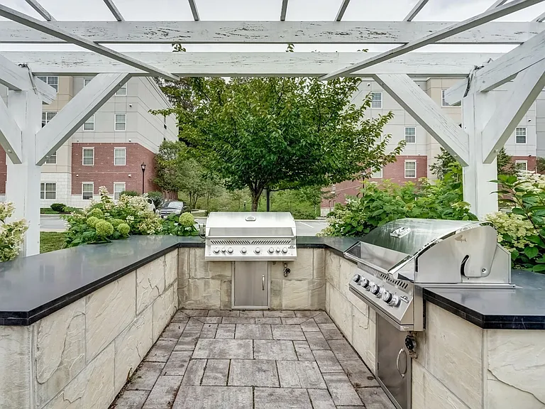 A shaded space for outdoor cooking and connection.