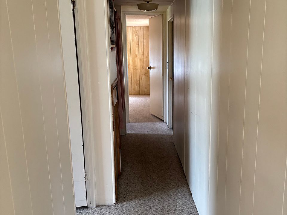 Hallway with storage closet.