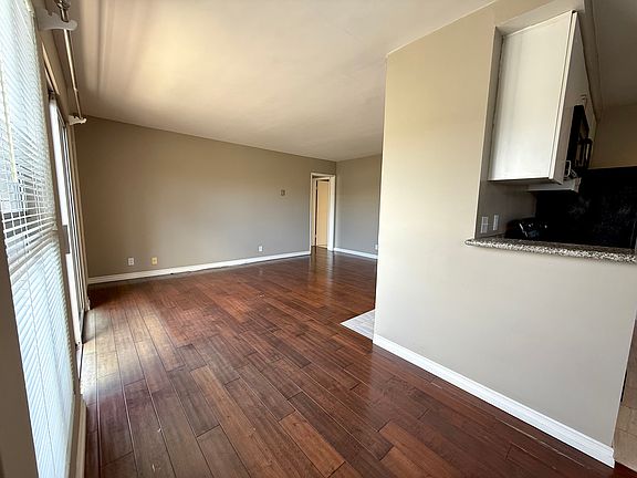 View of living room from kitchen/dining area