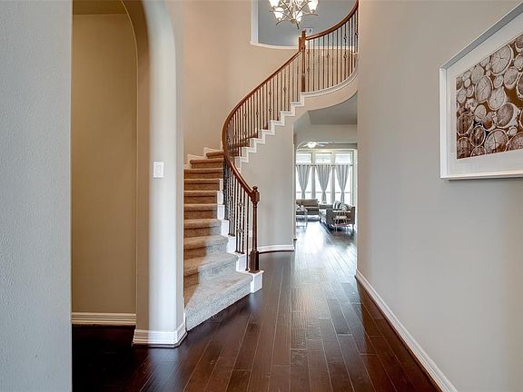 As you enter the home you are met with this spectacular 2-story staircase with oak posts and decorative wrought iron spindles. Just gorgeous!