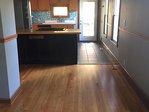 Entrance. Large front room can be used for dining, eat at bar in kitchen.