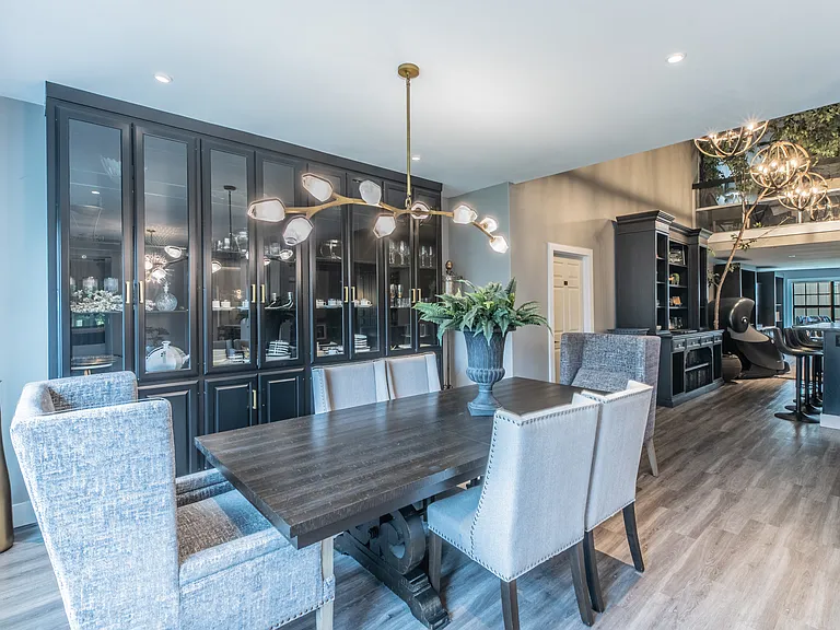 Sophisticated dining with high-end finishes and custom cabinetry.