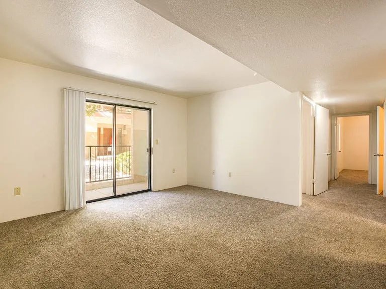 Spacious living room with natural lighting and patio access