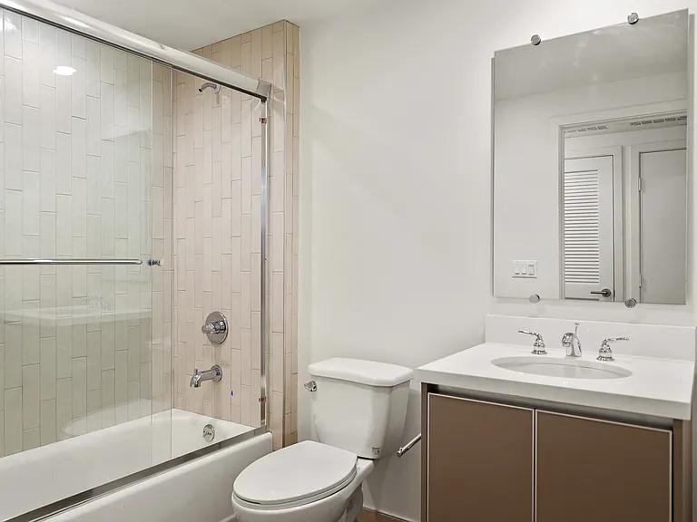 Bathroom with Vanity Cabinet Storage and Shower Bath
