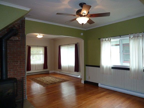 Beautiful wood floors, new gas free standing stove heats the whole house. Light comes in from every 