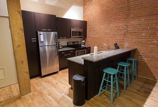 Kitchen with exposed brick