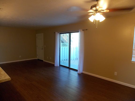 Living Room Open to Kitchen with Patio