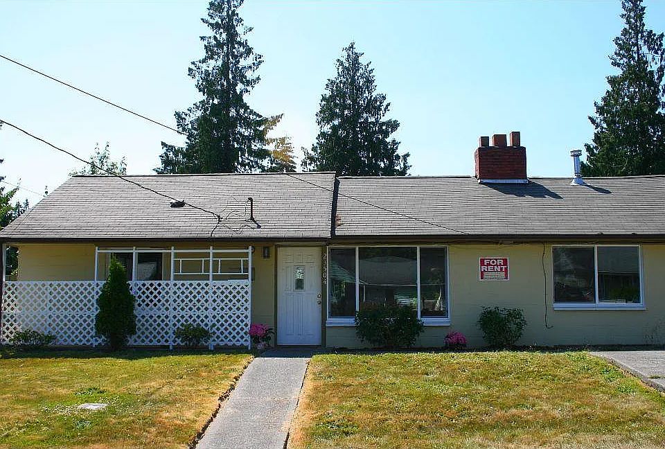 Front of home with drive-way on-street parking
