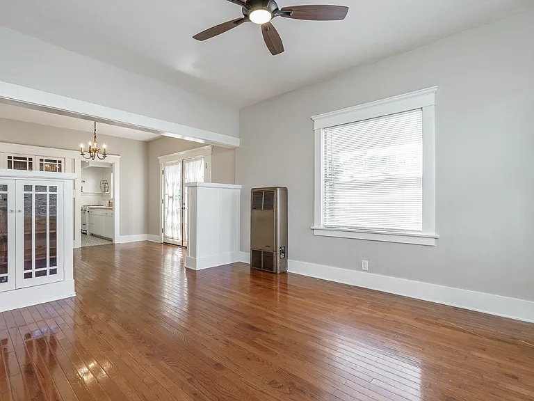 Living room and dining room with French doors to the side patio