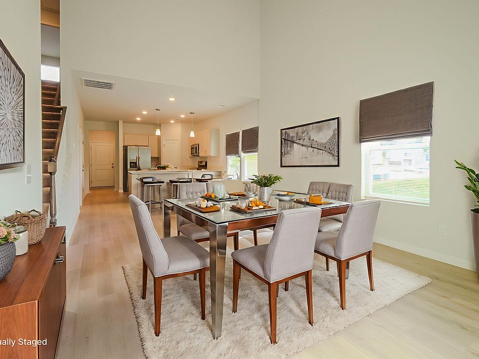 Dining area. Photo is virtually staged.
