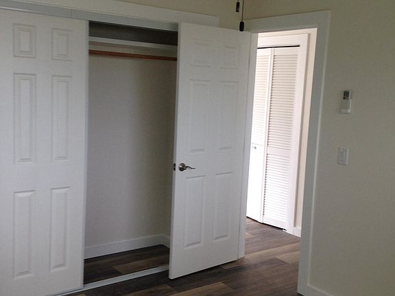 Bedroom with large double closet, ceiling fan and fixed spli