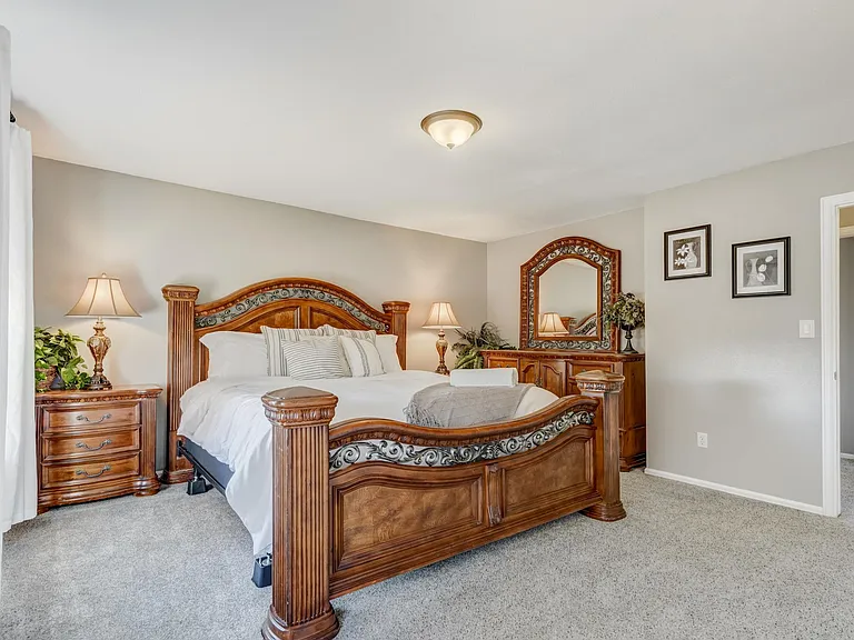 Master bedroom with a king sized bed and great natural light