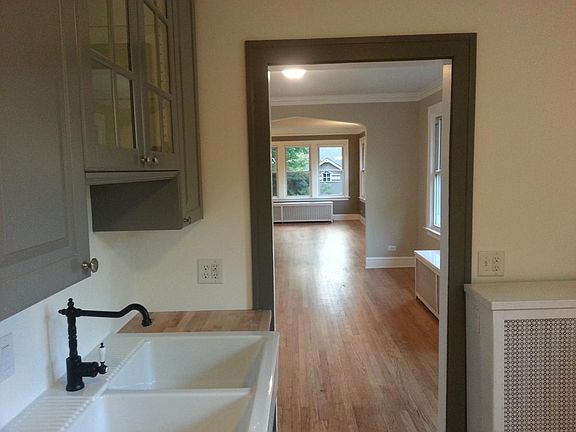 Kitchen, looking out to dining room and family room