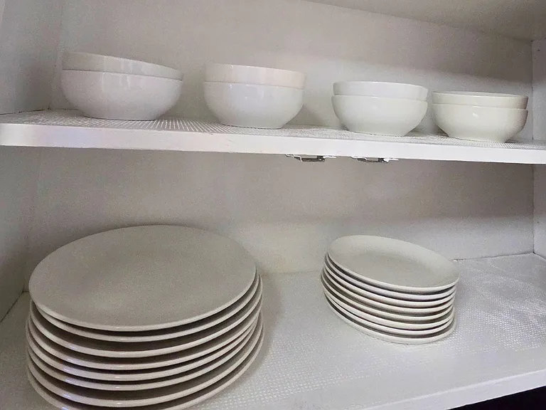 Dining essentials including flat plates, deep plates, and cups
