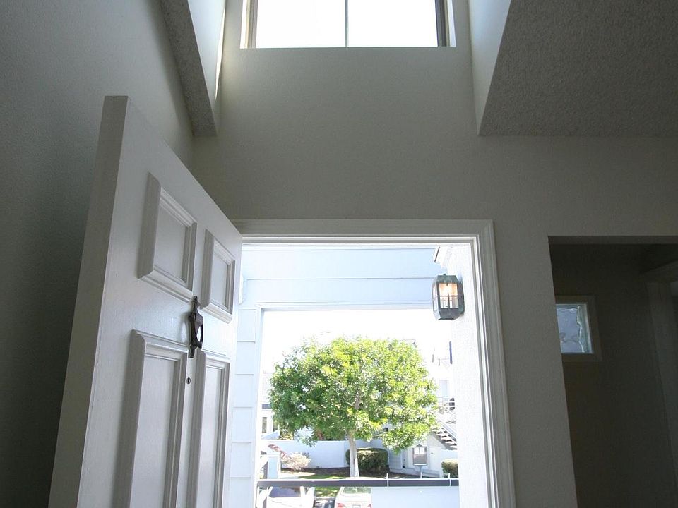 Grand, vaulted, bright entry and private deck. Architectural details make this space grand!