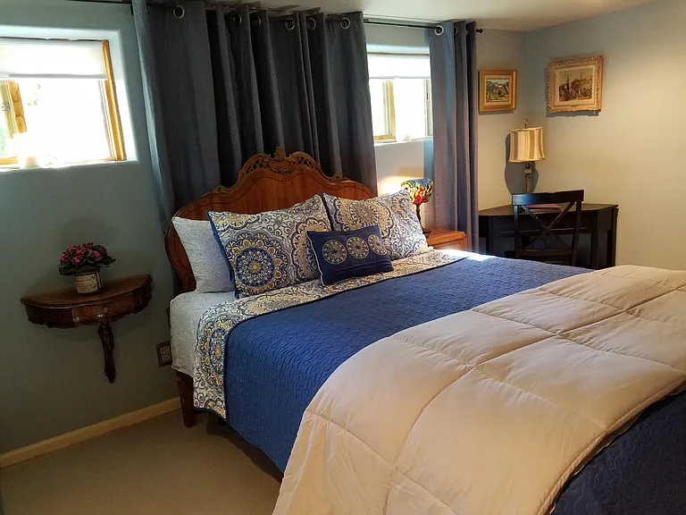 Garden level bedroom with en suite bathroom and heat rated fireplace