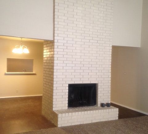 Large living room and separate dining area with fireplace