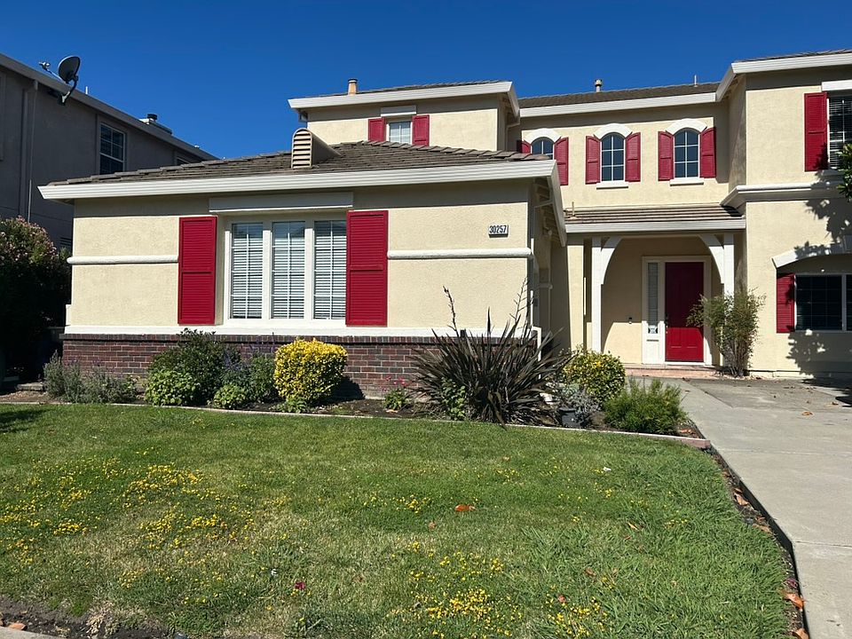 Front of the house, facing east, freshly painted exteriors