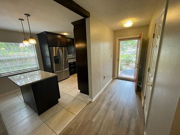 High-end kitchen with custom finishes, appliances and lighting