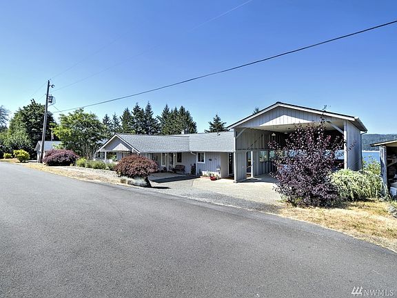 Huge oversized carport offers great parking for a boat or RV