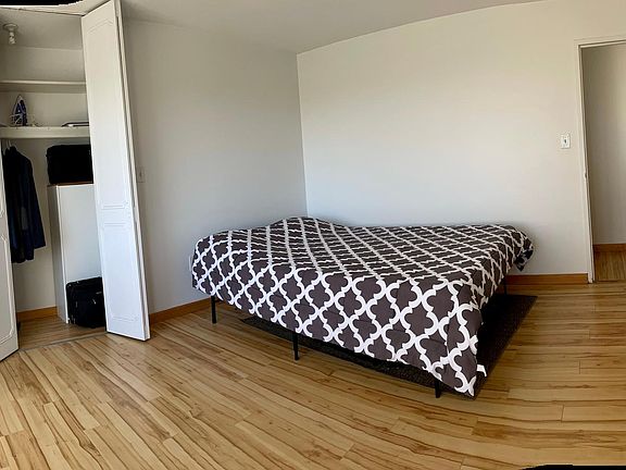 Large bedroom with new floors and good closet space.