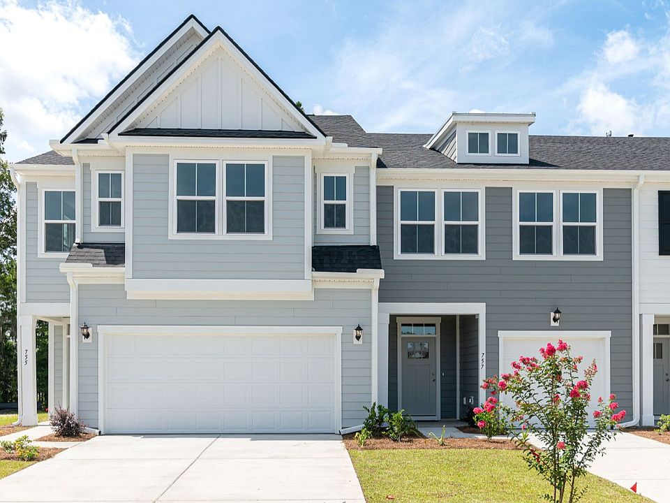 heron plan by DRB Homes featuring two car garage townhome