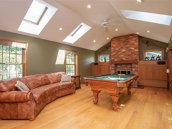 Vaulted ceiling living room with gas fireplace