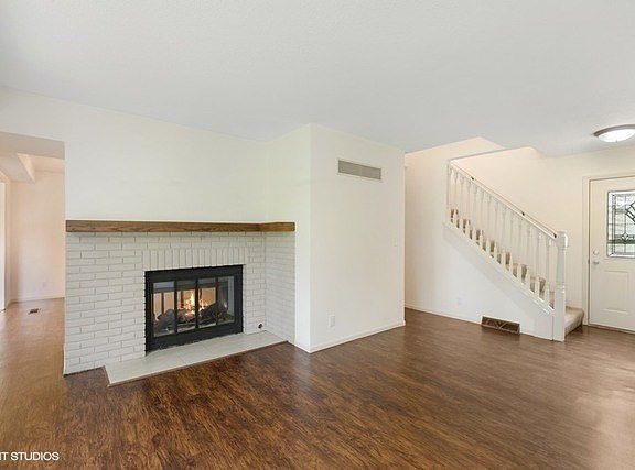 Private entrance with entry closet and two-sided gas log fireplace!