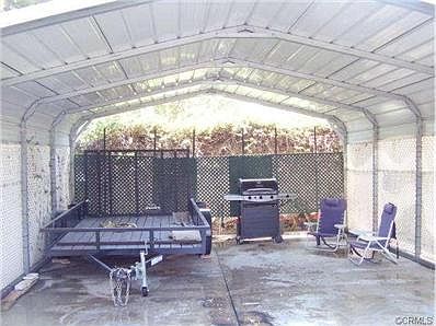 Carpot in addition to the Three Car Garage and RV Parking to the