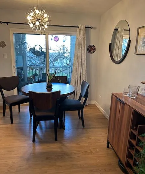 enclosed patio provides fresh air and relaxing private space. ceiling fan on patio