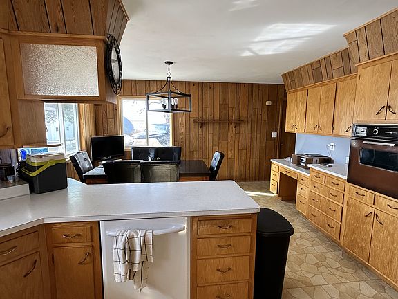 A view of all the spacious cabinetry provided. Versatile desk great for computer setup.