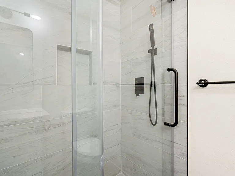 Brand-new modern bathroom with shower on the main floor.