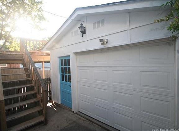 Bungalow has 1 car  detached oversized garage has storage shelves, room for work area.