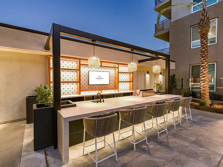 Relax at Modera Pomona's rooftop with ample seating, stunning views, and a cool California breeze, your perfect retreat.