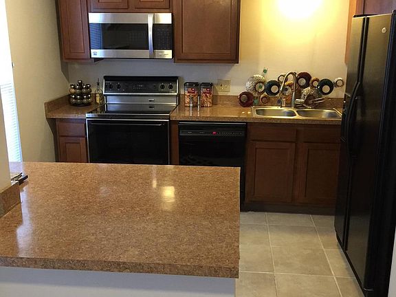 Kitchen with range, microwave, dishwasher, fridge, and new c
