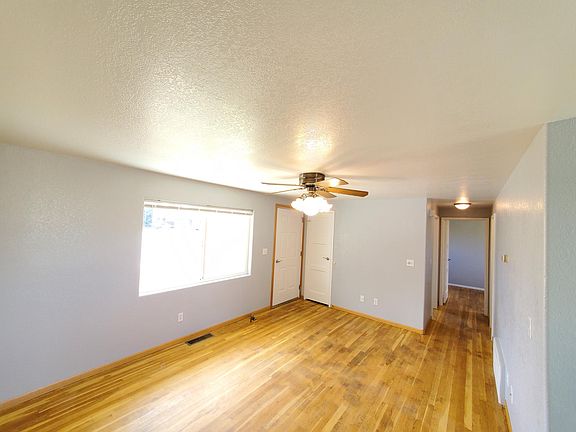 Living room area that features hardwood floors throughout.
