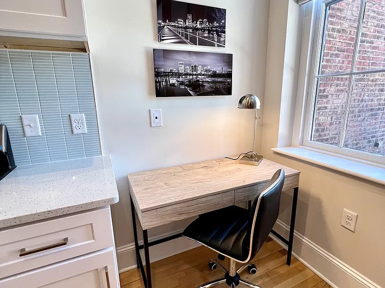 Work station at the end of the kitchen with view out onto the patio. Plug-in ethernet connection is located above the desk when your work (or play) demands the highest internet speed.