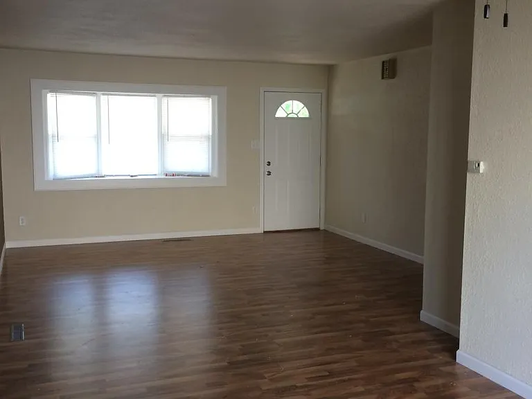 Please note: photos were taken prior to renovation. New luxury vinyl plank flooring, fresh paint throughout, new stainless steel appliances, and a new peninsula countertops are currently being installed.